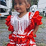 Calyana a rejoint le concours — aidez-le/la à gagner de superbes lots ! child, costume, cute, dress, fashion, fringe, girl, grass, happy, outdoor, pigtails, playful, portrait, red, ruffles, smiling, toddler, trees, vehicles, white