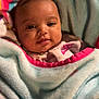 Amariana is registered to the contest to win money with this photo: baby, blanket, child, face, infant, person, portrait, smile, soft, warm, cozy, cute, clothing, indoors, head, babywear, wrapped, comfort, newborn, toddler