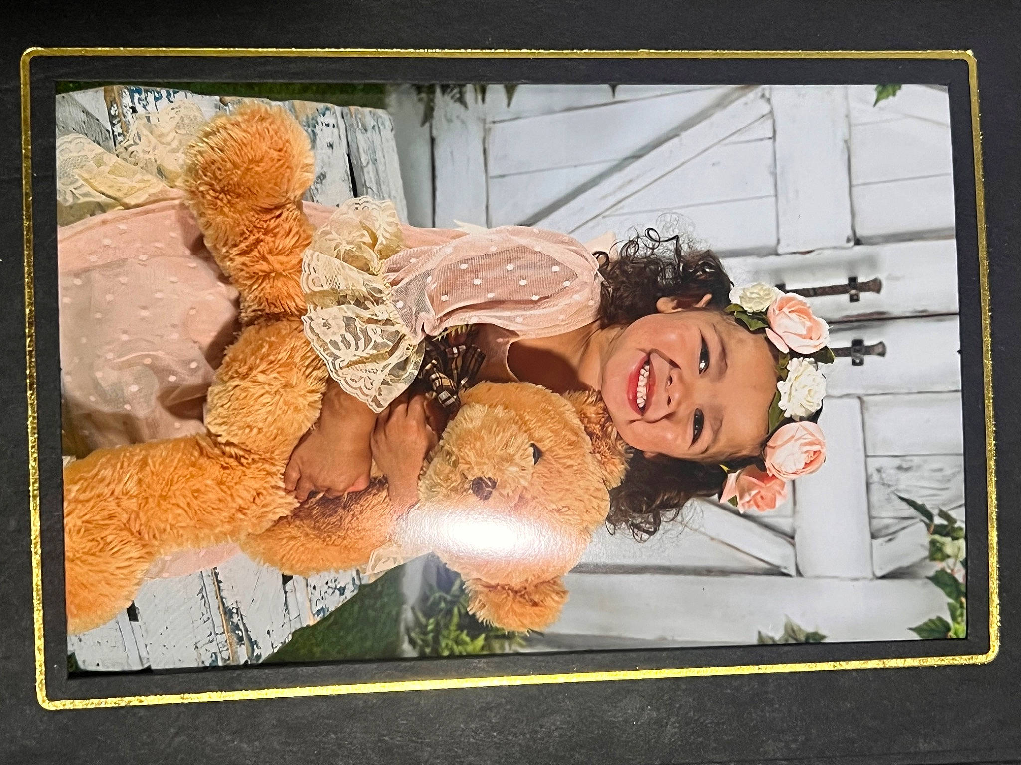 Eliza is registered to the contest to win money with this photo: advertising, art, child, creative_arts, display_device, floral_design, happy, illustration, joy, painting, person, photographic_paper, picture_frame, rectangle, room, still_life, vintage_clothing, visual_arts, window