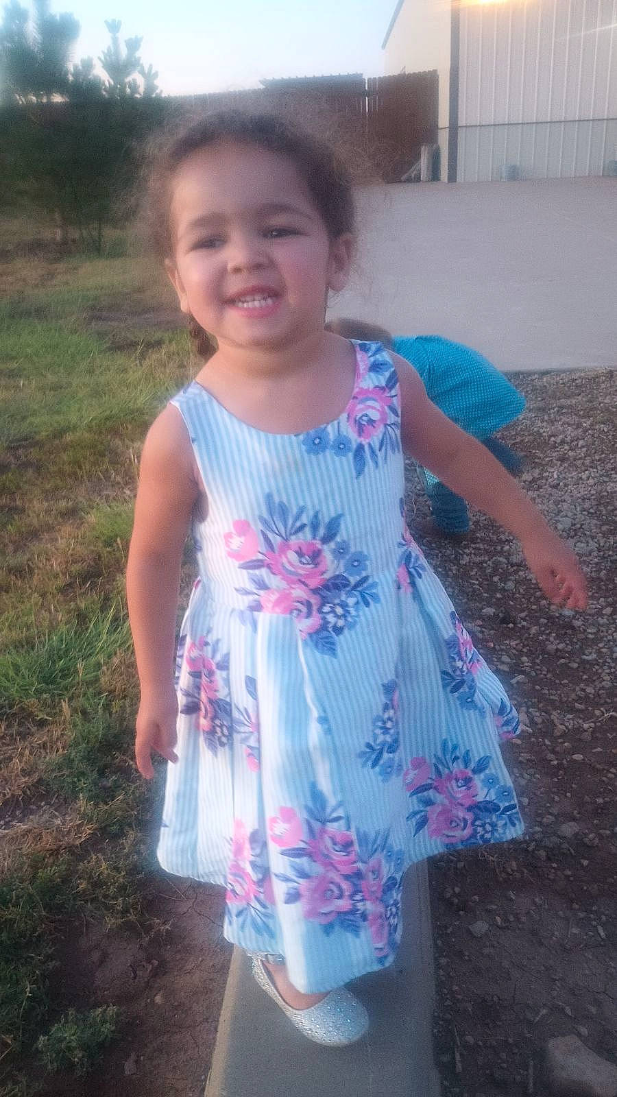 Eliza is registered to the contest to win money with this photo: baby_toddler_clothing, day_dress, dress, electric_blue, eye, face, fun, grass, hair, happy, head, joy, magenta, one_piece_garment, person, pink, plant, sleeve, smile, standing