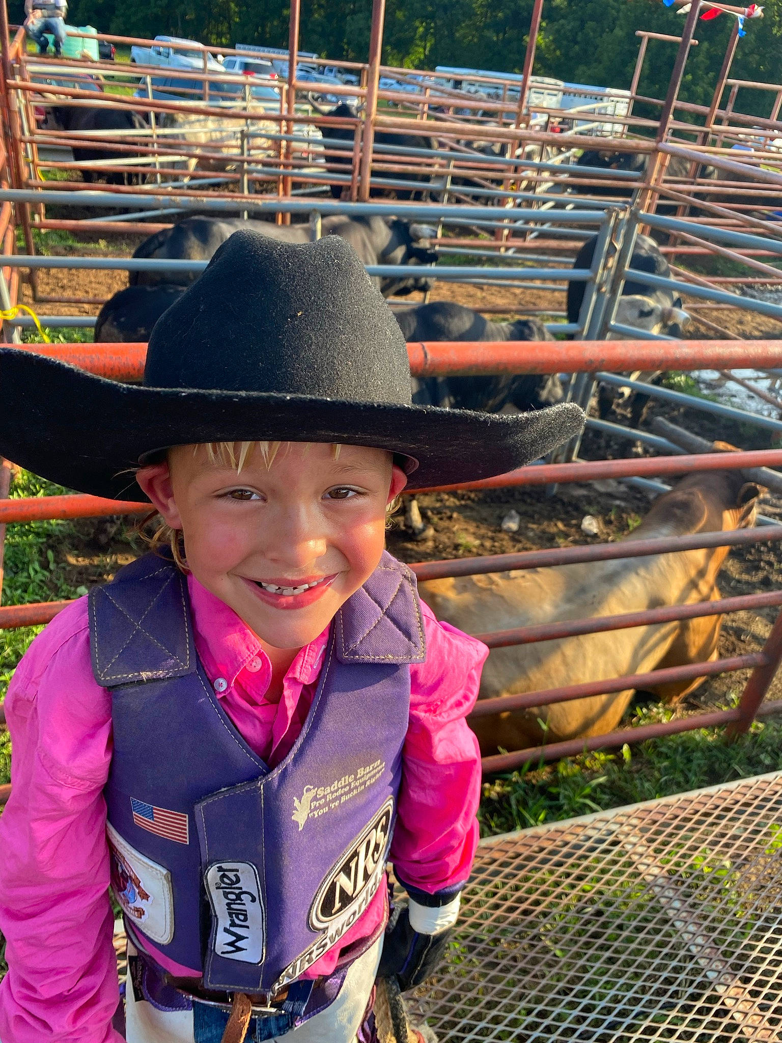 Wyit is registered to the contest to win money with this photo: face, fashion_accessory, fun, grass, happy, hat, headgear, headwear, joy, landscape, leaf, leisure, magenta, mammal, person, recreation, smile, snapshot, sun_hat, toddler