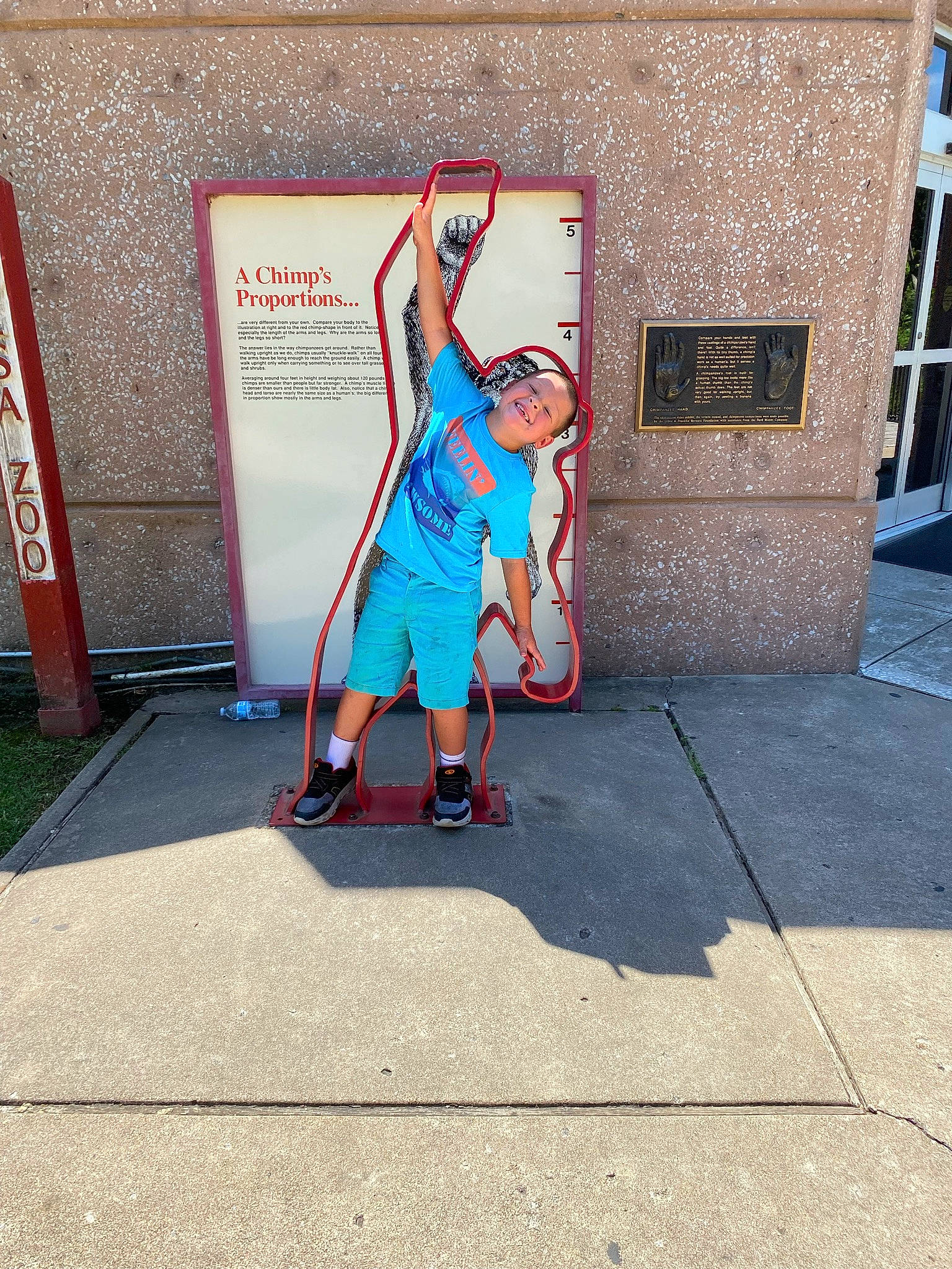 Stetson is registered to the contest to win money with this photo: advertising, art, artist, asphalt, concrete, door, electric_blue, gesture, human_leg, joy, leisure, mural, painting, person, recreation, road, road_surface, shorts, sidewalk, street