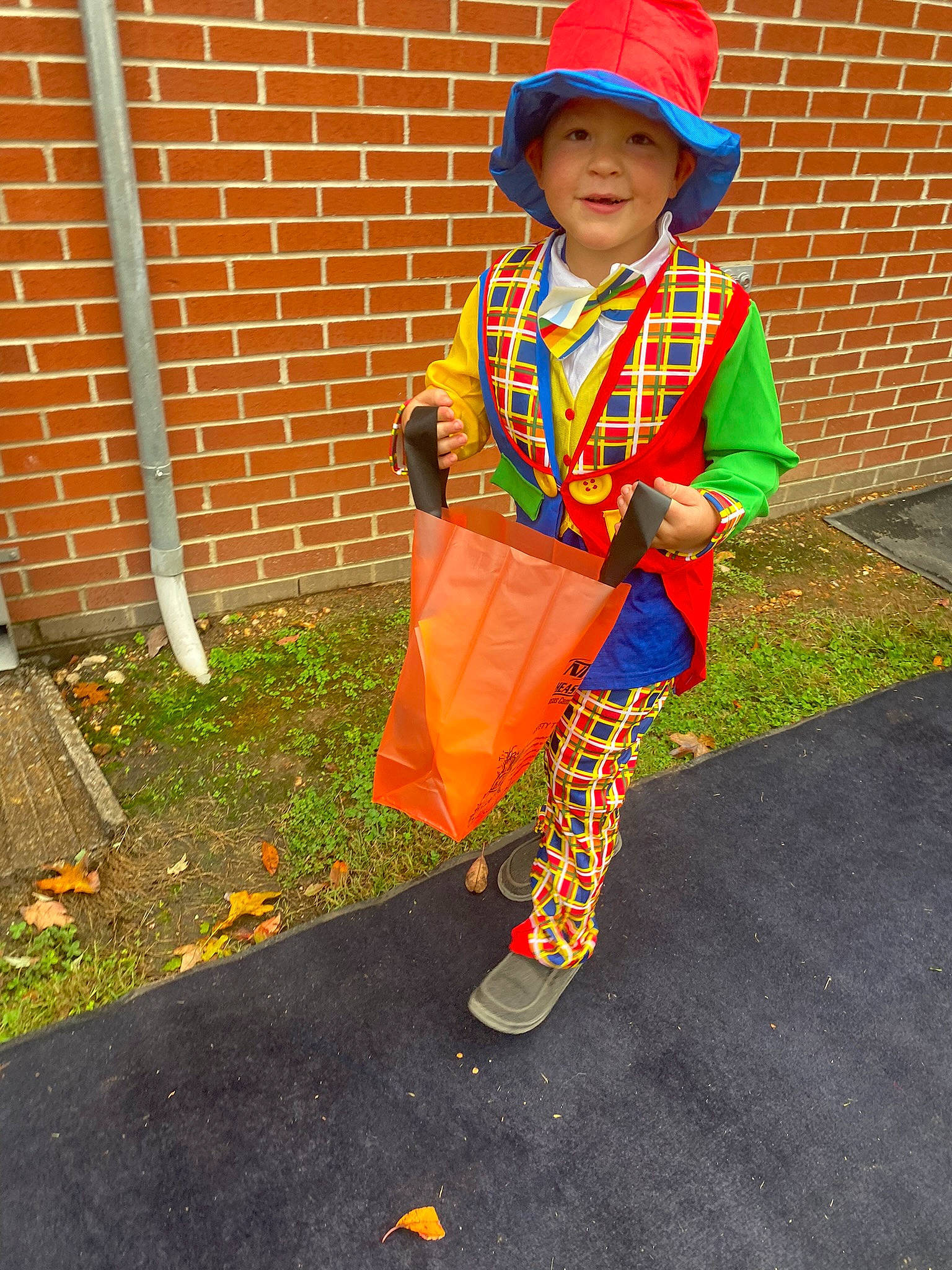 Stetson joined the competition — help win amazing prizes! baby, brick, brickwork, child, costume, costume_hat, electric_blue, fashion_accessory, fun, grass, hat, headgear, headwear, joy, orange, outerwear, pattern, person, smile, street_fashion