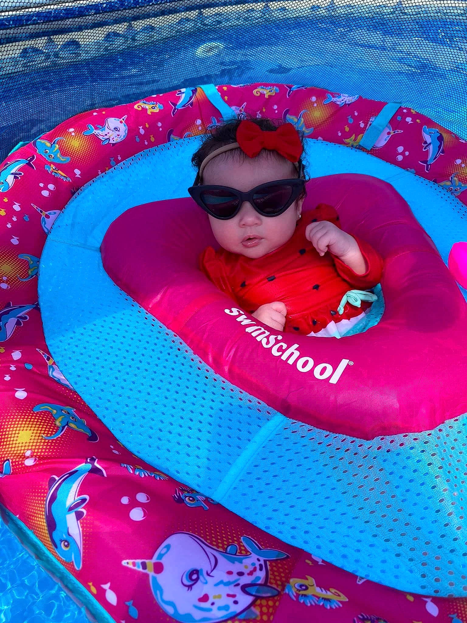 Rowyn is registered to the contest to win money with this photo: baby_float, baby_products, games, headwear, inflatable, leisure, magenta, person, pink, product, recreation, toy