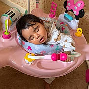 Zavannah joined the competition — help win amazing prizes! toddler, sleeping, baby, activity_jumper, pink, toy, indoor, carpet, child, face, clothing, foot, wallpaper, pattern, play, seat, colorful, hand, head, peaceful