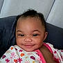 Te'Aari is registered to the contest to win money with this photo: baby, babylaughing, bodypart, clothing, couch, cushion, dress, face, furniture, happy, head, homedecor, laughing, mouth, person, photography, portrait, selfie, smile, teeth