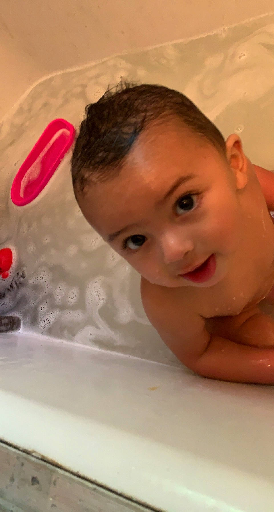Jorden is registered to the contest to win money with this photo: baby_bathing, bathing, bathtub, cheek, chin, eyebrow, face, facial_expression, fluid, hairstyle, happy, iris, lip, mouth, nose, organ, person, product, skin, smile
