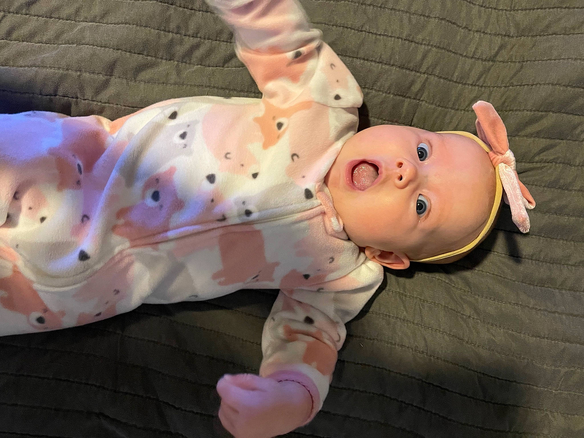 Bennett is registered to the contest to win money with this photo: baby, baby_products, baby_toddler_clothing, cheek, child, chin, comfort, eye, fawn, finger, foot, head, headgear, human_body, lip, nose, person, pink, sleeve, thumb