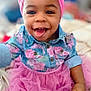 baby, child, smiling, tongue_out, headband, pink, floral, denim, shirt, skirt, clothing, portrait, happy, cute, indoor, person, face, infant, toddler, playful