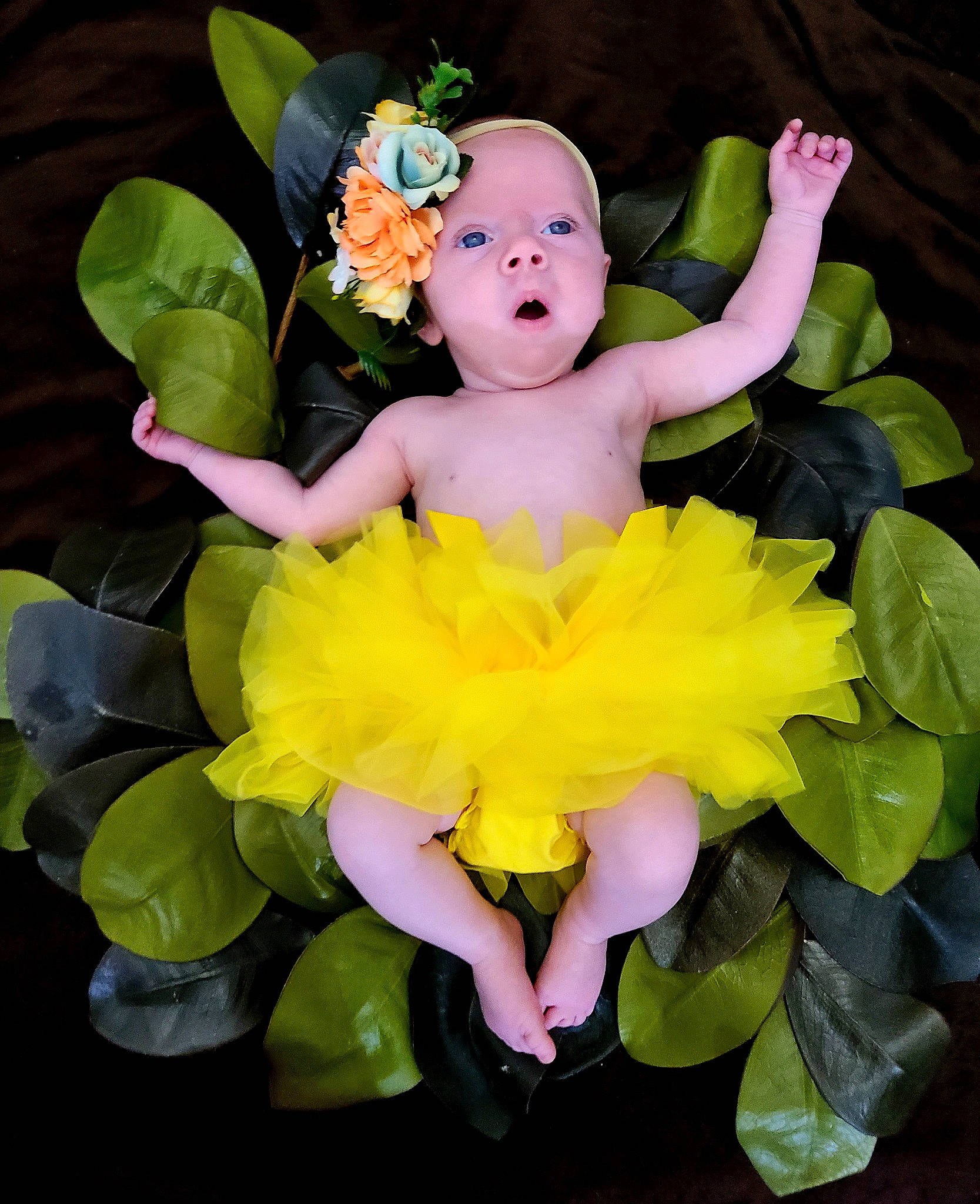 Luna is registered to the contest to win money with this photo: baby_toddler_clothing, bouquet, child, cut_flowers, event, floral_design, flower, flower_arranging, flowering_plant, happy, head, headgear, headpiece, headwear, mythical_creature, person, petal, pink, plant, toy