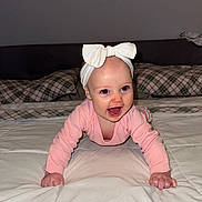 Madeline is registered to the contest to win money with this photo: baby, babycrawling, bed, bedroom, bodypart, couch, crawling, cushion, face, finger, furniture, hand, head, homedecor, indoors, newborn, person, photography, portrait, room