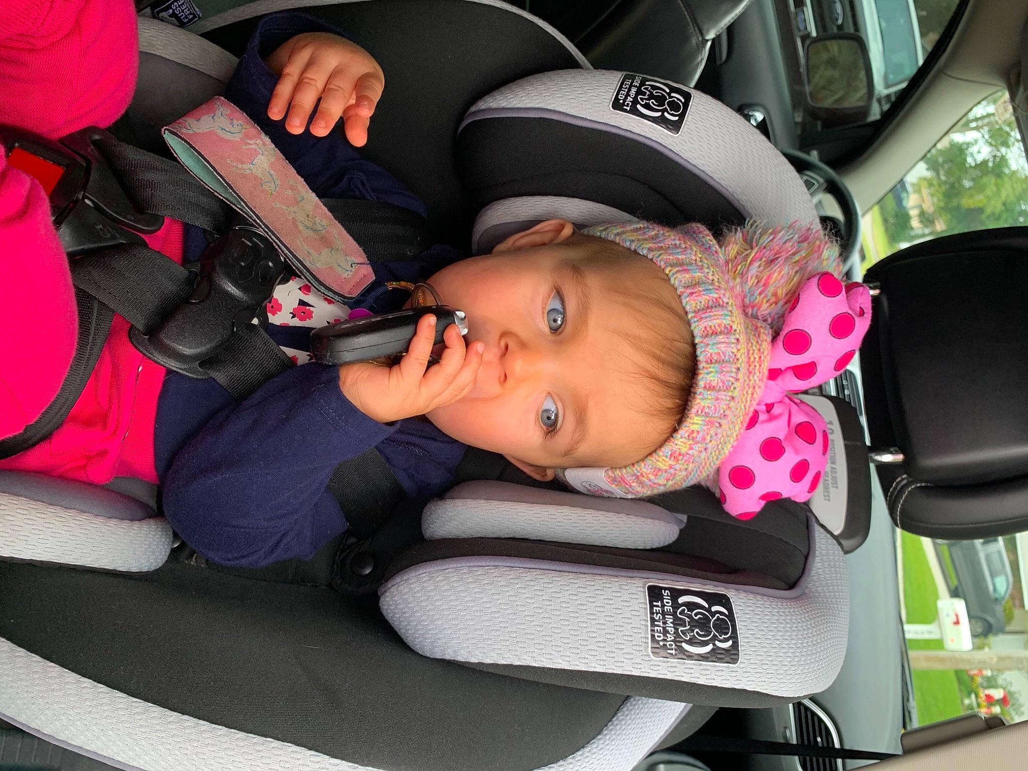 Lauryn is registered to the contest to win money with this photo: automotive_mirror, baby, baby_carriage, baby_in_car_seat, baby_products, baby_safety, baby_toddler_clothing, car_seat, car_seat_cover, carmine, child, comfort, head_restraint, lap, person, product, seat_belt, service, steering_part, toddler