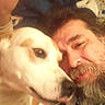 Wifi is registered to the contest to win money with this photo: animal, beard, brown_patches, casual, close_up, comfort, cuddle, dog, face, friendship, human, indoor, man, pet, portrait, relaxed, selfie, snuggling, warm, white_dog