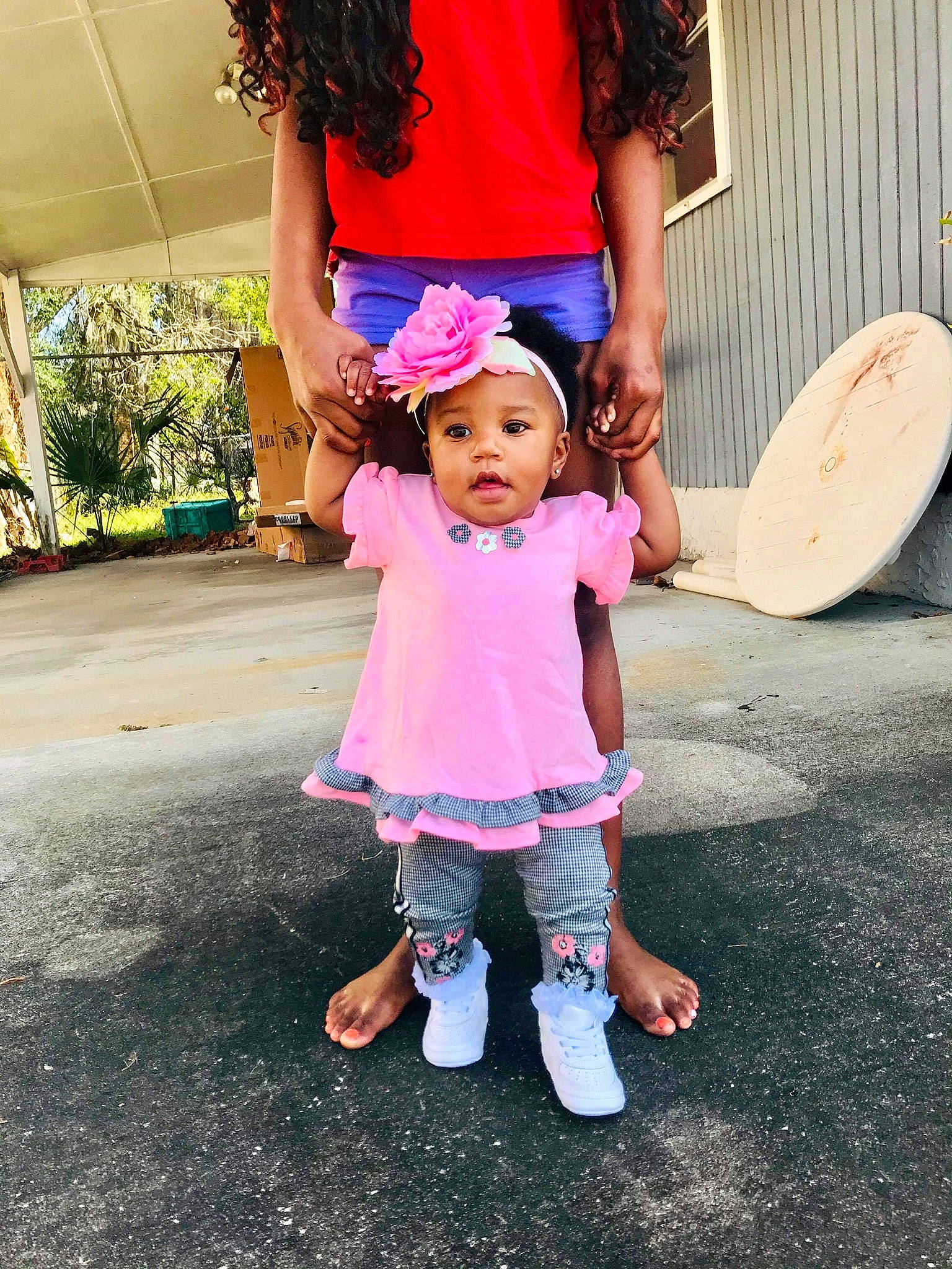 Unity is registered to the contest to win money with this photo: cool, facial_expression, footwear, gesture, hairstyle, hand, happy, hat, headwear, human_body, jeans, leg, leisure, person, pink, plant, shoe, sleeve, sneakers, t_shirt