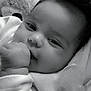 baby, infant, face, hand, smile, teddy_bear, black_and_white, portrait, cozy, cute, child, soft, clothing, indoors, closeup, sleepy, happy, young, person, toddler