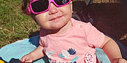 Léanna participe au concours pour gagner de l'argent avec cette photo : baby, bottle, child, clothing, cute, grass, happy, hat, outdoor, person, pink, playtime, popsicle, shade, smile, summer, sunglasses, sunny, toddler, towel