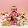 Mia participe au concours pour gagner de l'argent avec cette photo : baby, child, teddy_bear, pink_background, pink_clothing, soft_rug, smiling, cute, plush_toy, indoors, portrait, sitting, happy, toy, childhood, studio_photo, cozy, warm_colors, small_child, infant