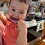 Sutton joined the competition — help win amazing prizes! cabinet, child, coral_top, curly_hair, cute, happy, holding, indoors, kettle, kitchen, person, pink, playful, portrait, smiling, stove, sunglasses, toddler, towel, wooden_floor