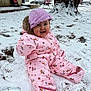 Sutton joined the competition — help win amazing prizes! baby, child, snow, winter, pink_snowsuit, purple_hat, smiling, outdoor, tree, snowflakes, cold_weather, snowy_ground, happy, sitting, clothing, cute, playful, nature, seasonal, fun