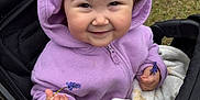 Sutton is registered to the contest to win money with this photo: baby, blanket, child, clothing, cute, face, flower, grass, hand, happy, hoodie, lavender, nature, outdoor, person, portrait, purple, smile, stroller, toddler