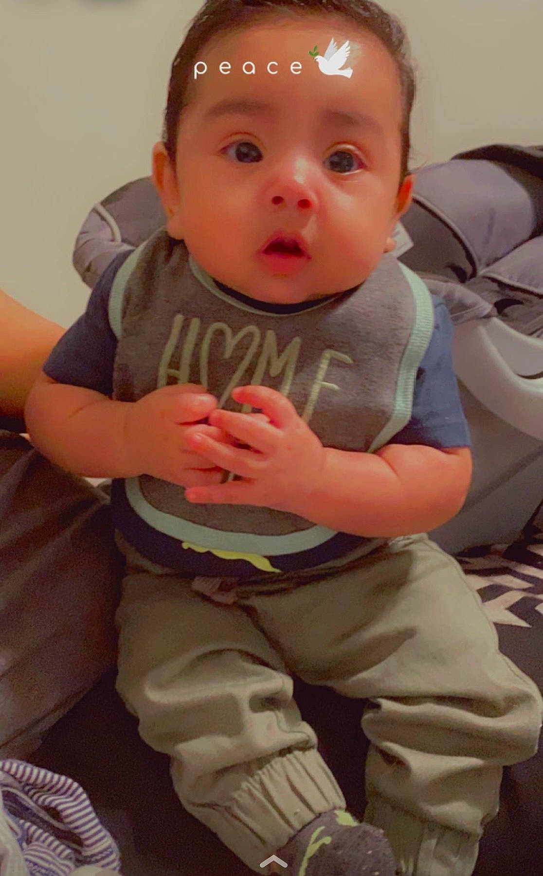 Ismael joined the competition — help win amazing prizes! baby, baby_toddler_clothing, cheek, comfort, eye, face, finger, gesture, hairstyle, head, human_body, joint, lip, mouth, neck, person, pink, skin, sleeve, surprise