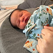 Zion joined the competition — help win amazing prizes! animal_pattern, baby, bed, blanket, child, cozy, cushion, cute, hand, indoor, infant, newborn, nursery, peaceful, portrait, resting, sleeping, soft_lighting, toddler, wrapped
