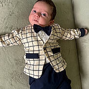 Miqayel a rejoint le concours — aidez-le/la à gagner de superbes lots ! baby, bow_tie, child, clothing, cute, expression, eyes, face, fashion, feet, hands, indoors, infant, jacket, lying_down, person, portrait, socks, soft_surface, young