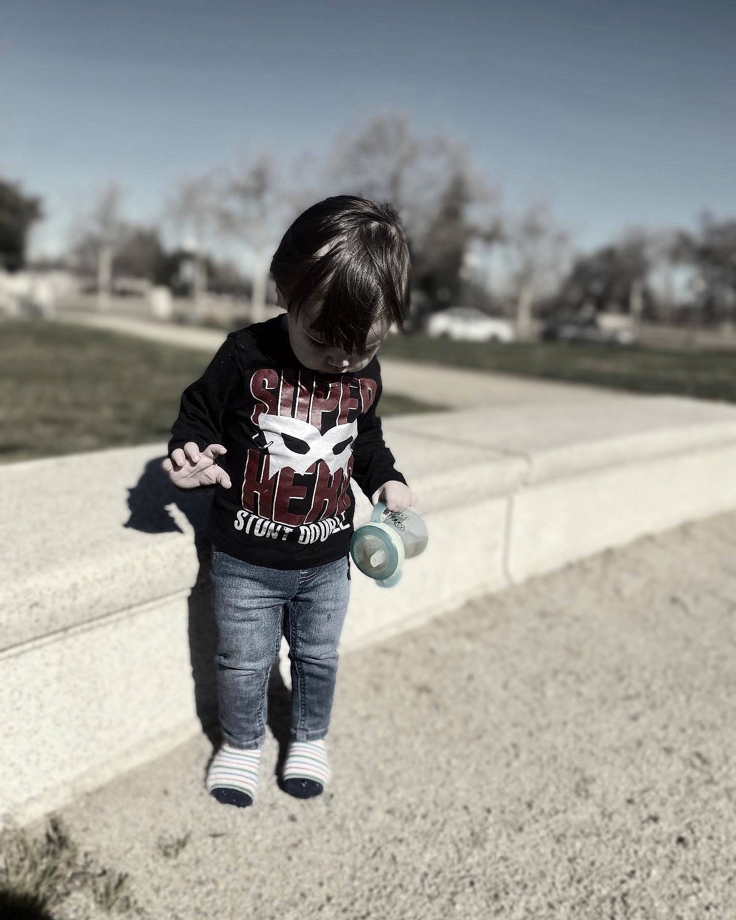 Elijah is registered to the contest to win money with this photo: asphalt, beauty, cool, denim, flash_photography, grey, hairstyle, happy, human, jeans, person, recreation, rolling, shoe, sky, sneakers, street_fashion, style, t_shirt, toddler
