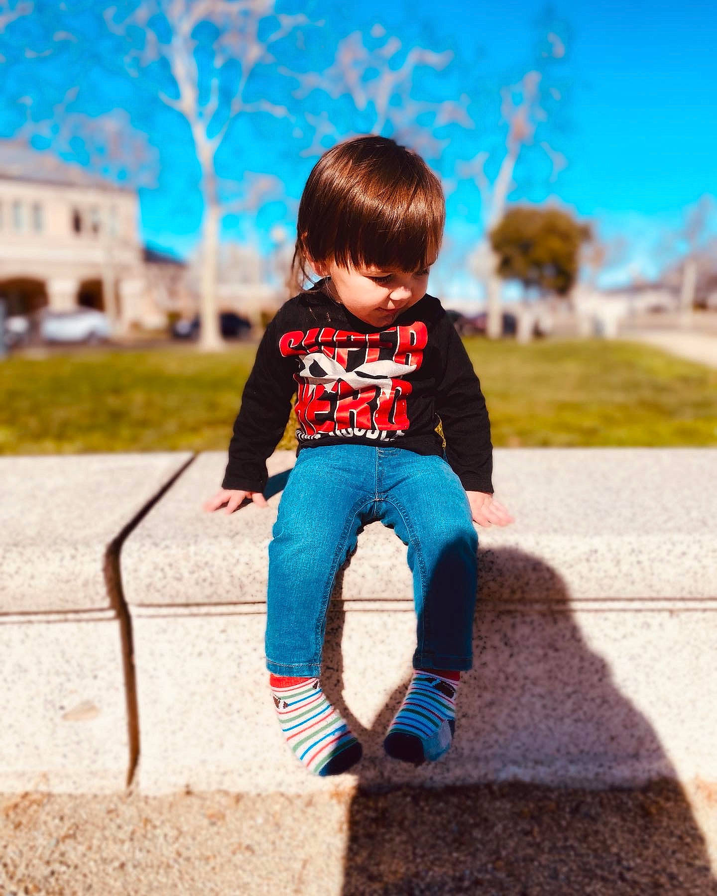 Elijah is registered to the contest to win money with this photo: azure, blue, denim, doll, electric_blue, grass, happy, leg, leisure, person, plant, sky, sleeve, standing, street_fashion, t_shirt, tints_and_shades, toy, tree, waist