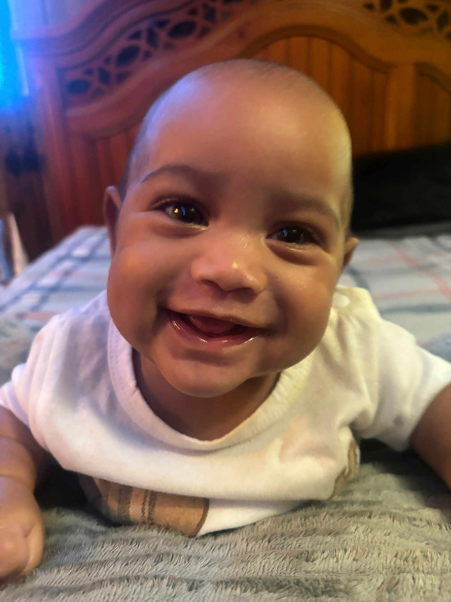 Kurrency joined the competition — help win amazing prizes! baby, smiling, face, infant, child, happy, cute, indoor, blanket, white_clothing, portrait, closeup, head, person, young_child, expression, skin, eyes, mouth, furniture