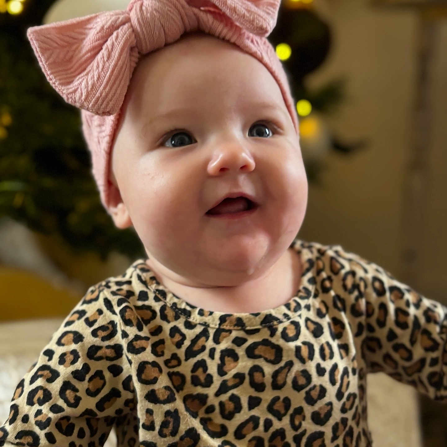 Grace is registered to the contest to win money with this photo: accessories, baby, beanie, bodypart, bonnet, cap, clothing, face, finger, hand, happy, hat, head, headband, newborn, pattern, person, photography, portrait, smile