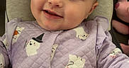 Kaizlei joined the competition — help win amazing prizes! baby, child, infant, smiling, portrait, indoors, seated, lavender_clothing, quilted_outfit, ghost_pattern, costume, cozy, chair, cushion, toy, face, eyes, happy, close_up, photography