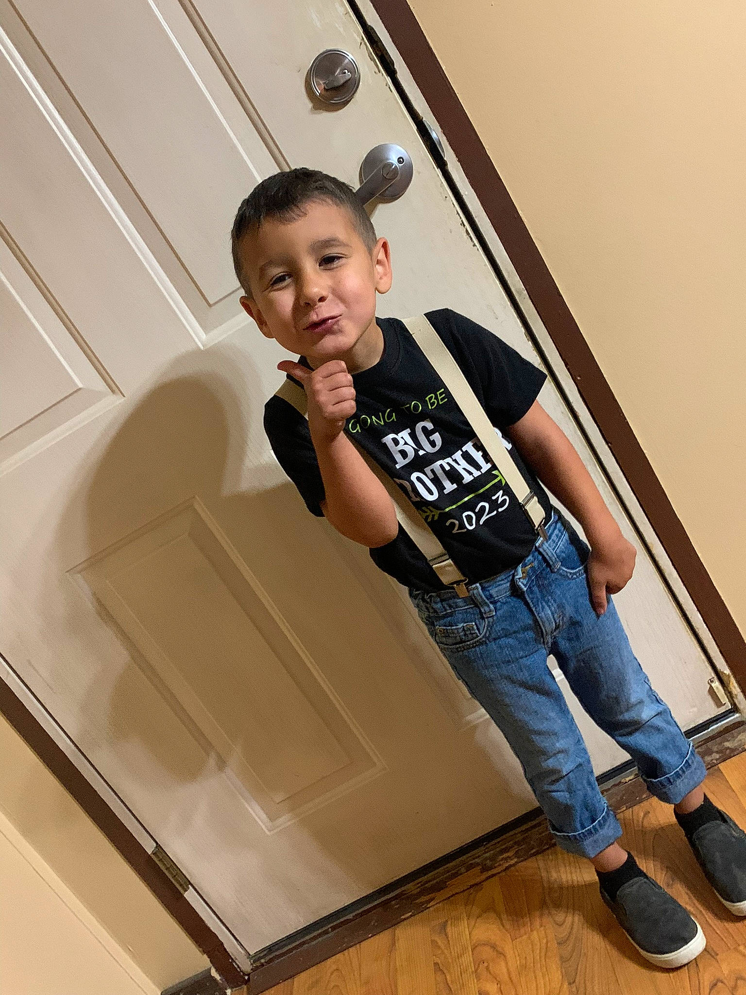 Hagen is registered to the contest to win money with this photo: door, elbow, flash_photography, flooring, fun, handrail, hardwood, human_leg, knee, leisure, person, room, shorts, sleeve, stairs, t_shirt, thigh, toddler, waist, window