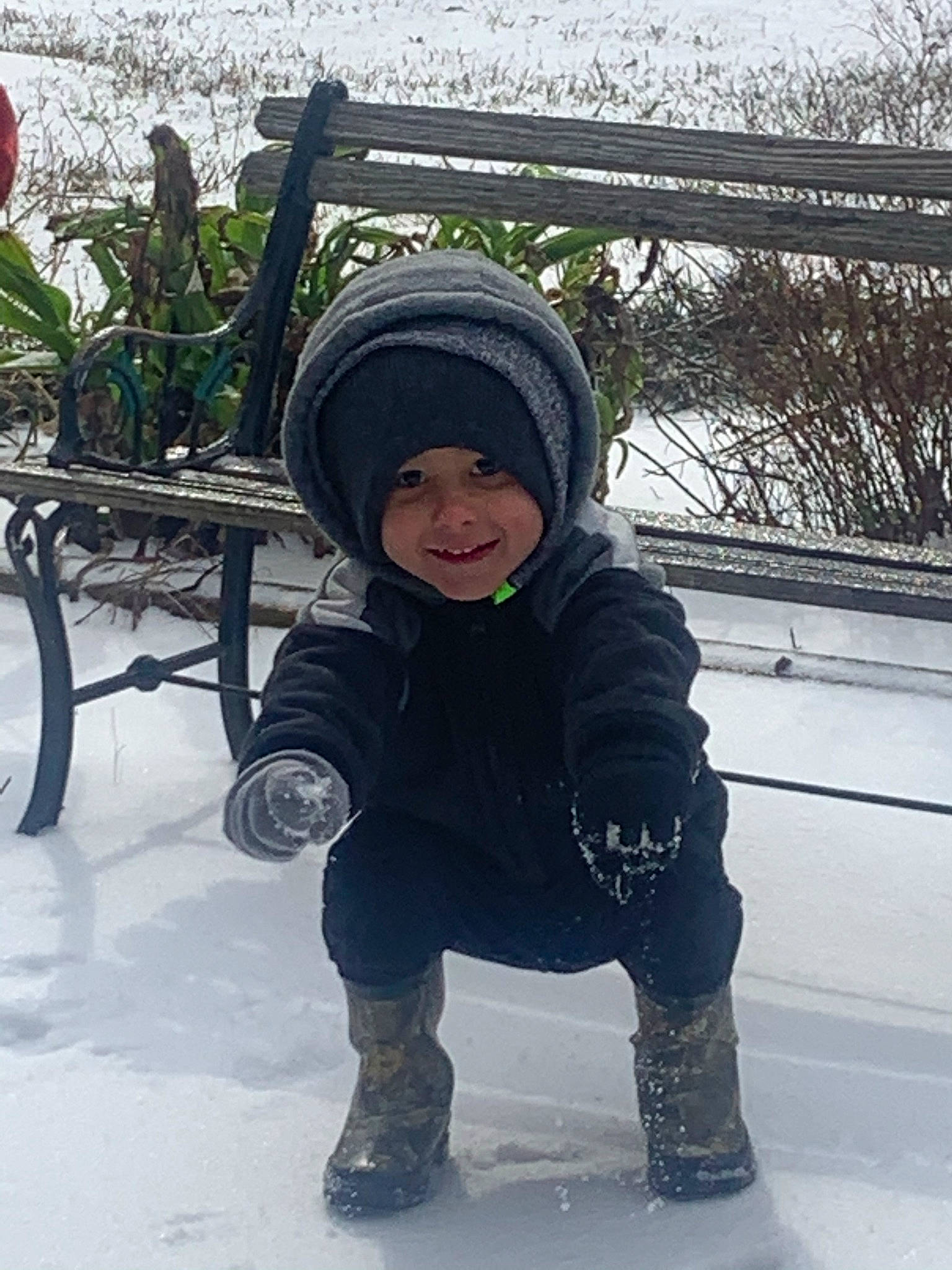 Hagen joined the competition — help win amazing prizes! child, face, fence, freezing, fun, happy, headwear, jacket, joy, leisure, outdoor_furniture, person, plant, play, playing_in_the_snow, precipitation, recreation, sitting, smile, snow