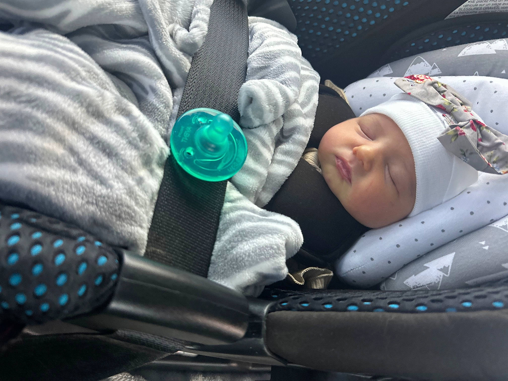 Sarabeth is registered to the contest to win money with this photo: auto_part, baby, baby_carriage, baby_products, baby_toddler_clothing, car_seat, child, cloud, comfort, cool, electric_blue, fashion_accessory, headwear, linens, nap, pattern, person, sitting, sleep, textile