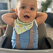 Paul a rejoint le concours — aidez-le/la à gagner de superbes lots ! baby, child, high_chair, bib, striped_clothing, happy, smiling, face, blue_eyes, indoor, person, infant, cute, toddler, seat, furniture, expression, hands_up, home, blurred_background