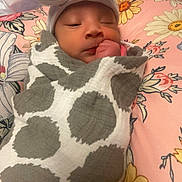 Mylianaa is registered to the contest to win money with this photo: baby, newborn, blanket, hat, bow, sleeping, infant, wrapped, cute, floral, pillow, pattern, polka_dot, cozy, resting, child, soft, indoors, portrait, peaceful