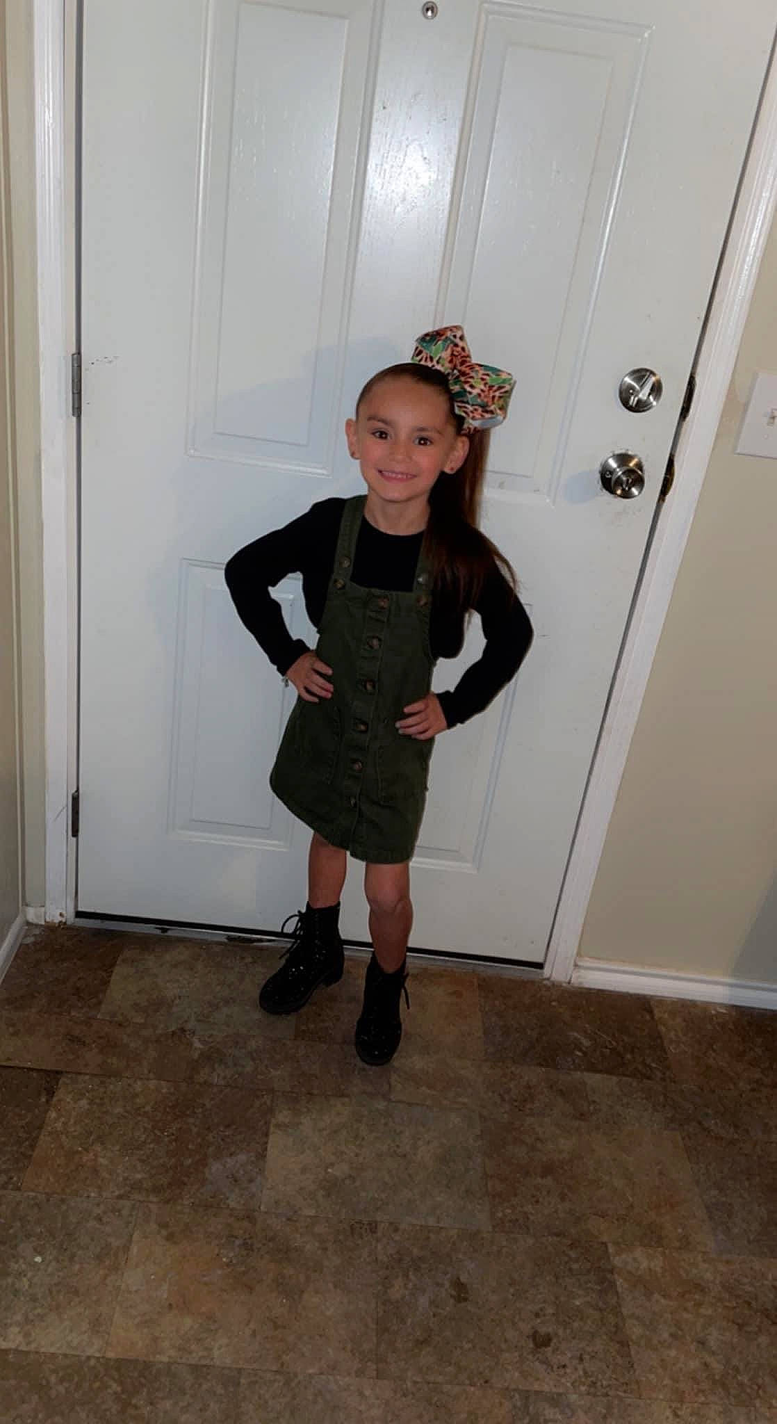 Ariyah is registered to the contest to win money with this photo: baby_toddler_clothing, boot, costume, costume_hat, day_dress, door, fashion_accessory, fashion_design, flooring, fun, fur, hat, joy, knee, pattern, person, personal_protective_equipment, room, sleeve, toddler