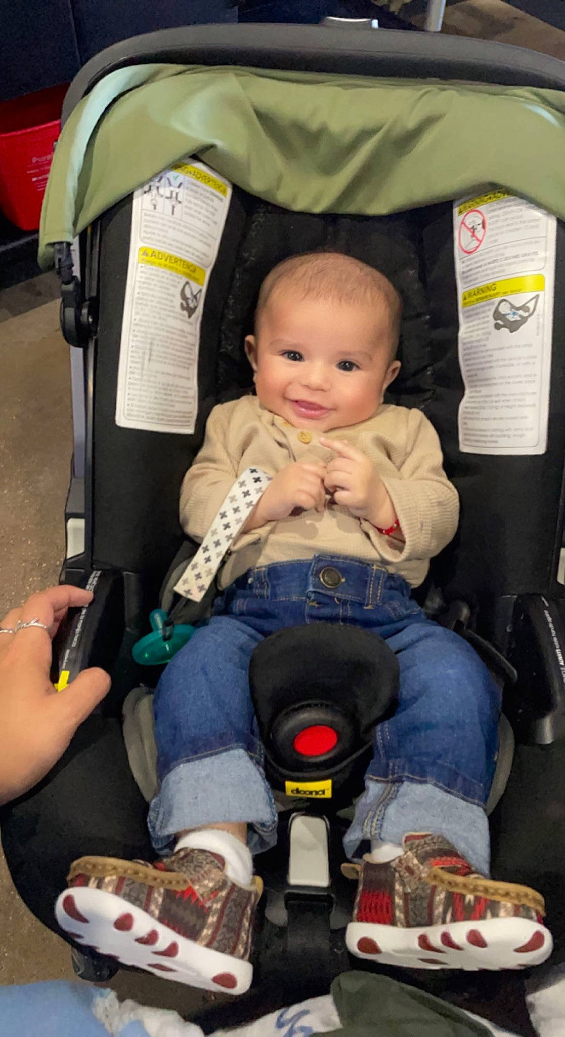 Avian is registered to the contest to win money with this photo: auto_part, baby, baby_carriage, baby_products, car_seat, child, comfort, fun, joy, lap, leg, motor_vehicle, person, photograph, product, shoe, sitting, snapshot, sneakers, toddler