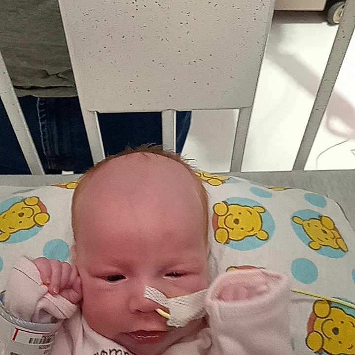 Willow is registered to the contest to win money with this photo: adult, baby, bed, bodypart, car, crib, cutlery, face, furniture, head, infantbed, machine, male, man, newborn, person, spoon, transportation, vehicle, wheel