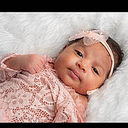 Nova is registered to the contest to win money with this photo: baby, infant, pink_lace, headband, pearls, soft_texture, white_fur, portrait, cute, child, newborn, sleepy, closeup, face, skin, hand, lying_down, adorable, fashion, toddler