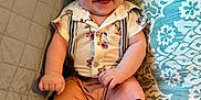 Jaxson is registered to the contest to win money with this photo: baby, smiling, infant, couch, pillow, clothing, suspenders, shorts, happy, face, skin, foot, hand, sitting, indoors, quilt, pattern, head, cute, portrait