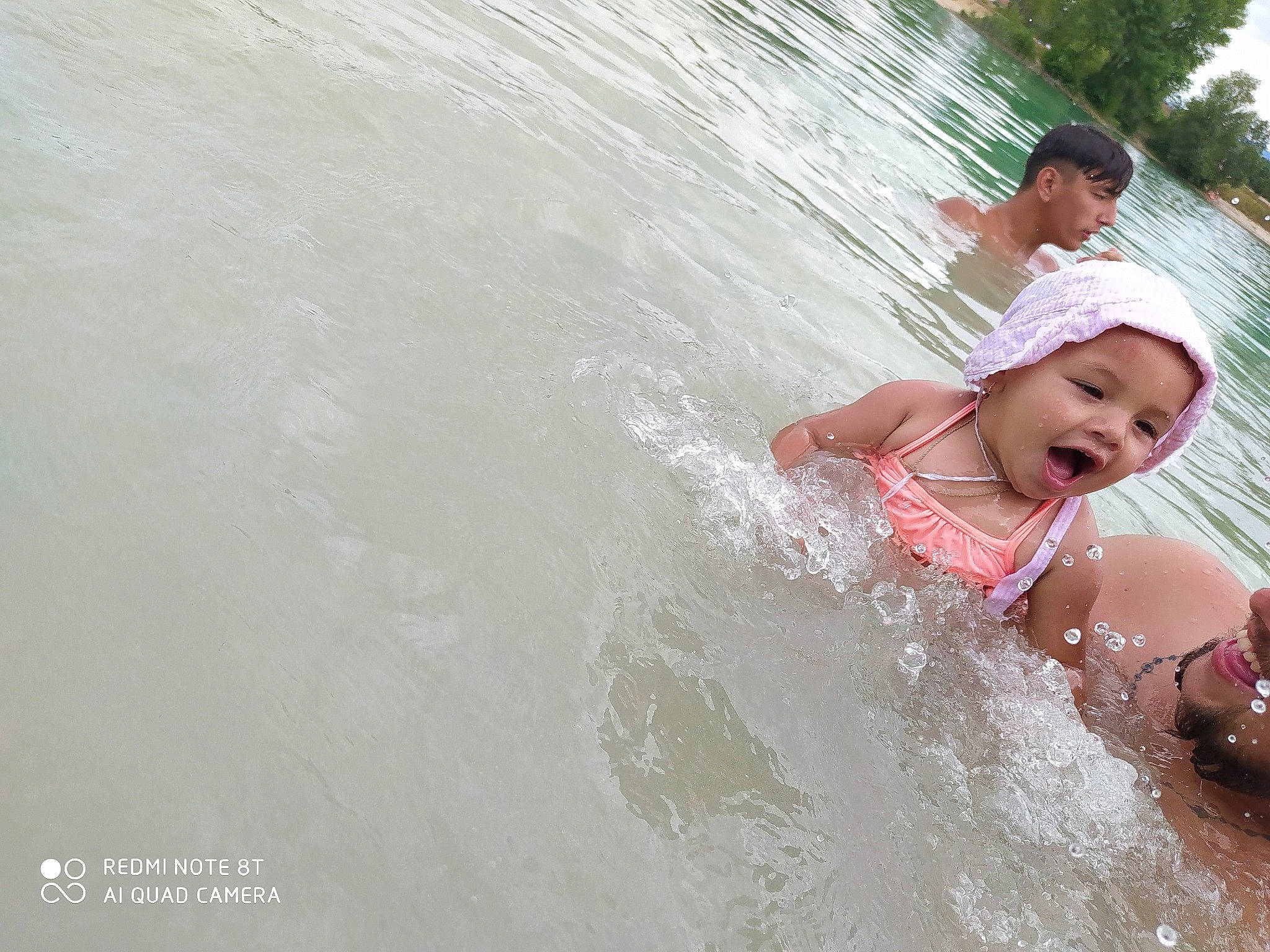 Mylëna participe au concours pour gagner de l'argent avec cette photo : bathing, beauty, black_hair, child, facial_expression, fun, happy, headwear, leisure, nose, person, photography, play, recreation, sea, skin, smile, summer, vacation, water
