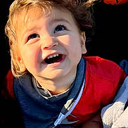 Isaiah joined the competition — help win amazing prizes! toddler, child, smiling, happy, face, hair, red_jacket, bib, blanket, toy, indoor, closeup, cute, baby, infant, portrait, warm_light, playing, joyful, expression