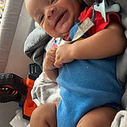 Jaidyn joined the competition — help win amazing prizes! baby, blanket, child, closeup, clothing, colorful, comfort, cushion, cute, face, happy, indoor, infant, lying_down, pacifier, person, playful, smiling, soft, young