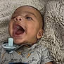Jaidyn joined the competition — help win amazing prizes! adorable, baby, blanket, carrot_pattern, child, closeup, cute, expression, face, happy, indoor, infant, laughing, lying_down, onesie, pacifier, skin, smiling, soft_texture, young