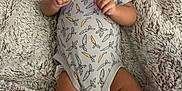 Jaidyn joined the competition — help win amazing prizes! baby, blanket, carrot_pattern, child, comfortable, cozy, curious, cute, expression, fluffy, hands, indoors, infant, legs, lying_down, onesie, portrait, skin, soft, toddler