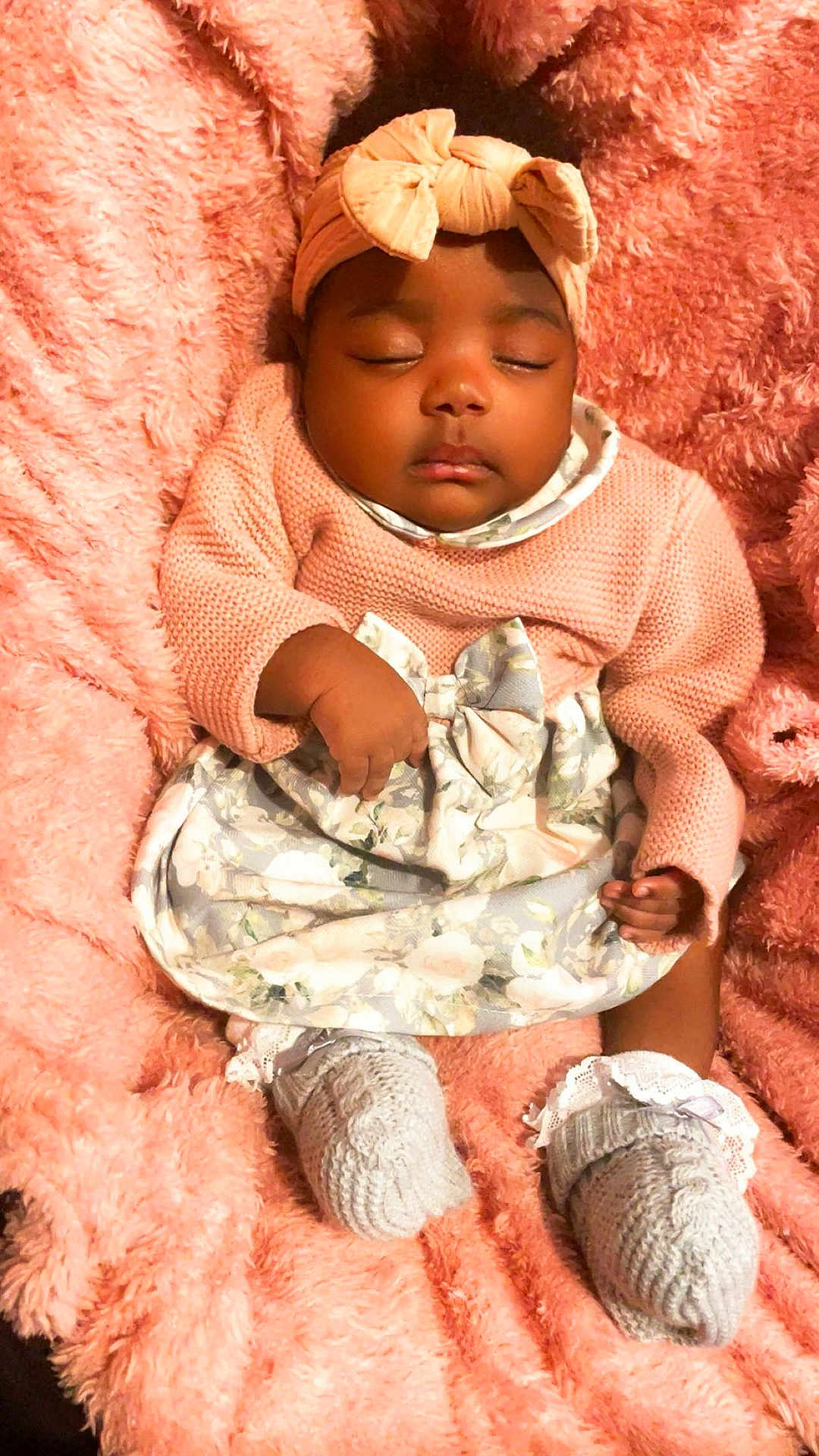 Roxane Adria joined the competition — help win amazing prizes! baby, sleeping, pink, blanket, knitted_booties, headband, dress, cozy, child, infant, soft_texture, cute, peaceful, portrait, warm, resting, adorable, comfort, small_hands, closeup