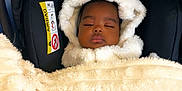 Roxane Adria joined the competition — help win amazing prizes! baby, sleeping, blanket, car_seat, soft_texture, hood, infant, child, peaceful, indoor, comfort, warm, black, cream, cozy, bundle, face, portrait, young, resting