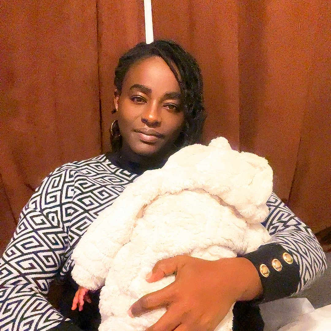 Roxane Adria joined the competition — help win amazing prizes! baby, black_hair, blanket, casual, cozy, curtain, earrings, face, family, hand, holding, indoor, long_sleeves, love, patterned_clothing, portrait, seated, tender, warm, woman